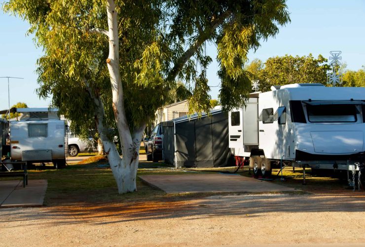 Camping with RVs and caravans in a scenic outdoor setting.