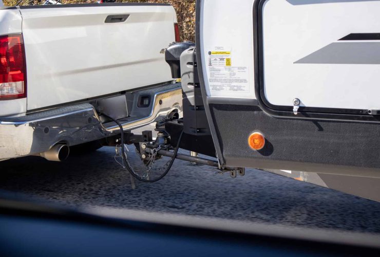 Trailer hitch connection on RV for travel adventures.