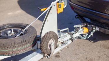 Boat trailer hitch attachment for vehicle towing and transport.