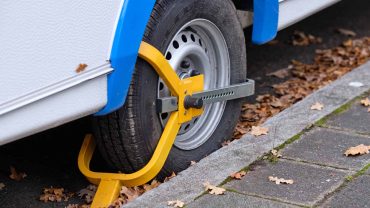 Wheel lock device on camper van tire.