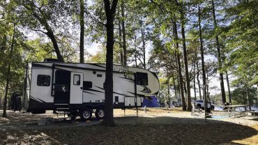 RV camping setup in a scenic forest location in Australia.