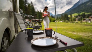 Camping breakfast table with mountain view in Australia.
