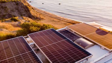Solar panels on campervan for sustainable travel and off-grid power solutions.
