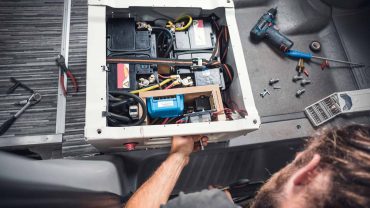 Battery system installation in a vehicle's interior.